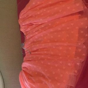Youth 10-12 coral star loose skirt.